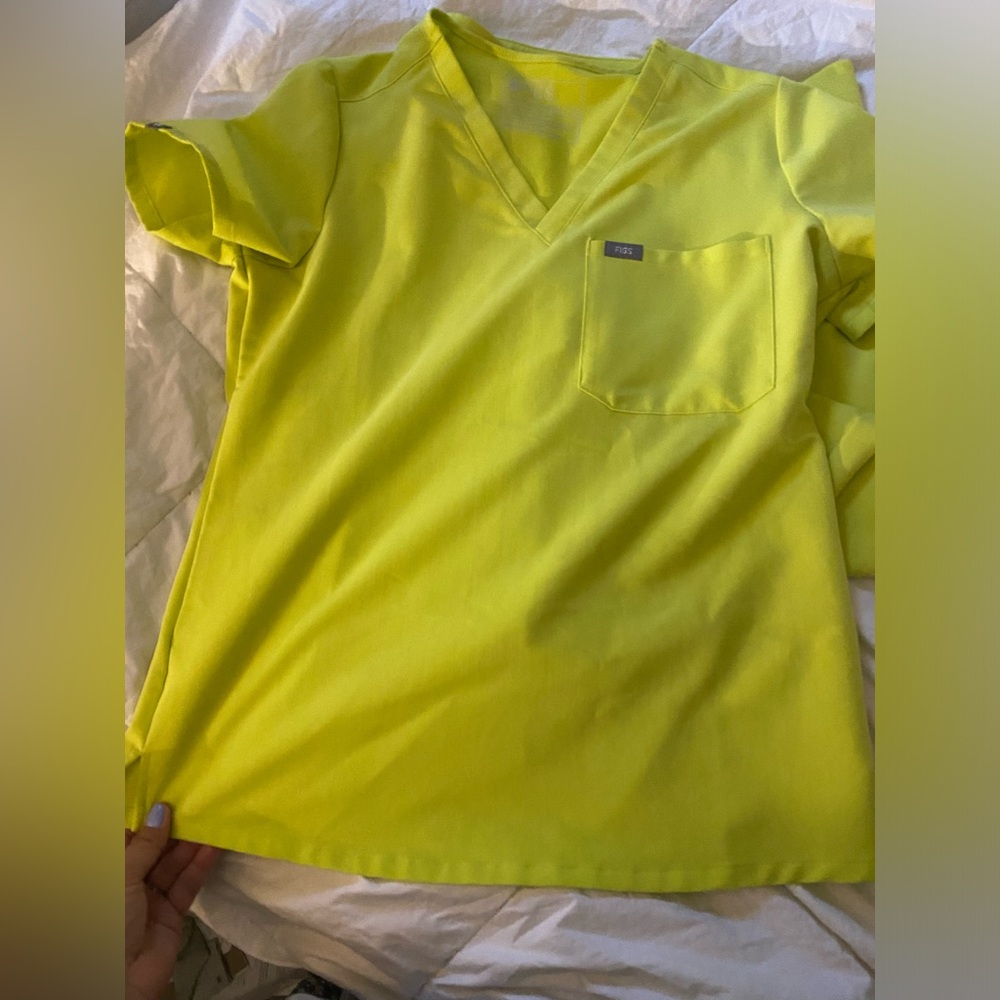 Figs small top with small petite pants. Limited color.